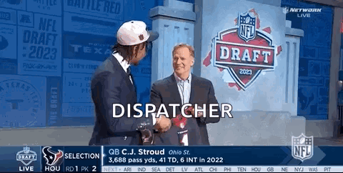 Two Men Shake Hands In Front Of A Sign That Says Dispatcher GIF
