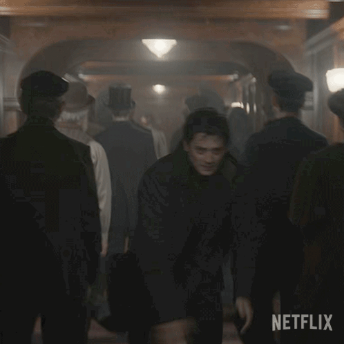 Two Men Shaking Hands in Crowd Netflix