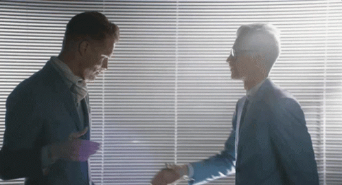 Two Men Shaking Hands In Front Of A Window GIF