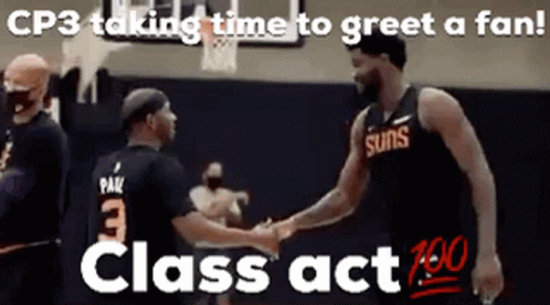 Two Men Shaking Hands on Basketball Court