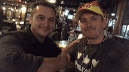 Two Men Shaking Hands With A Shirt GIF