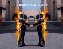 Two Men Shaking Hands With Flames Coming Out Of Their Bodies And The Words The Internet Is Just A Dream GIF