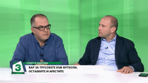 Two Men Sitting at Green Table Number 3