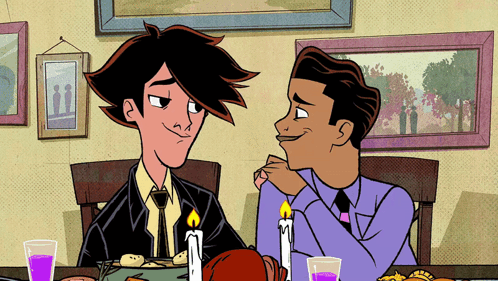 Two Men Sitting at Table with Candles