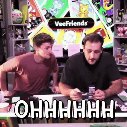 Two Men Sitting At Veefriends Sign GIF