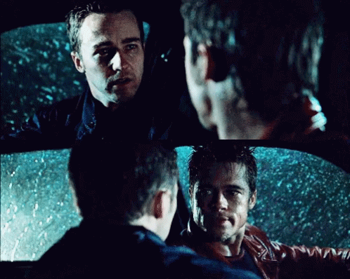 Two Men Sitting in a Car Talking