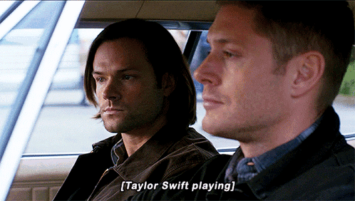 Two Men Sitting in Car Talking About Taylor Swift