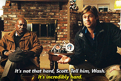 Two Men Sitting In Front Of A Fireplace With One Saying It 'S Not That Hard Scott Tell Him Wash GIF