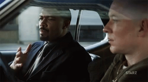 Two Men Sitting in Starz Car
