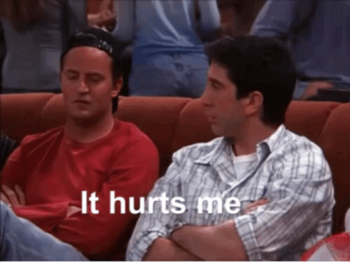 Two Men Sitting Next to Each Other Saying It Hurts Me