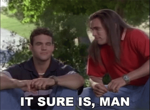 Two Men Sitting Next To Each Other Saying It Sure Is Man GIF