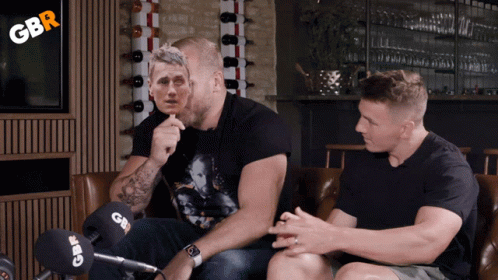 Two Men Sitting On A Couch With Gbr Written On The Corner GIF