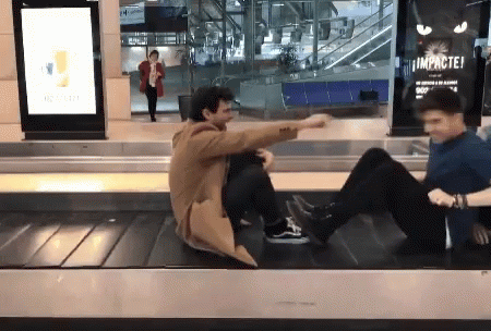Two Men Sitting on Conveyor Belt Saying Impactei