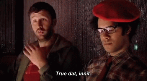 Two Men Sitting, One In Red Hat GIF