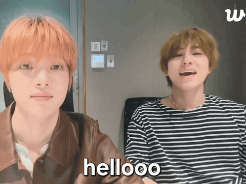 Two Men Sitting One Says Hellooo