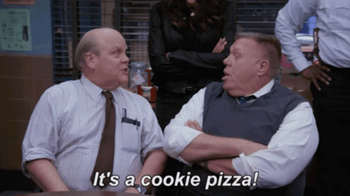 Two Men Sitting Saying It's a Cookie Pizza