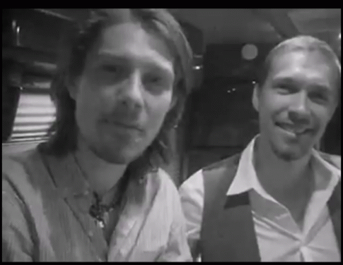 Two Men Smiling Black and White Photo
