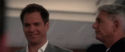 Two Men Smiling Side By Side GIF