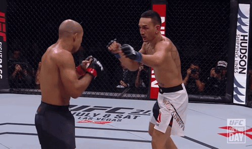 Two Men Smiling Side By Side GIF