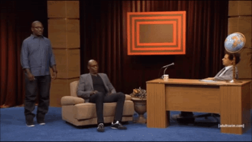 Two Men Standing and Sitting Adult Swim