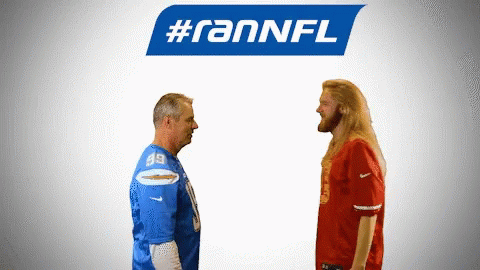 Two Men Standing Beside #RANNFL Logo