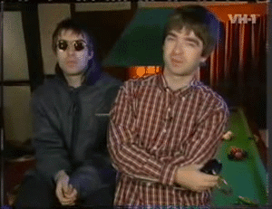 Two Men Standing by Pool Table With VH-T Background