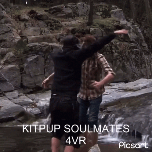 Two Men Standing In A Stream With The Words Kitpup Soulmates 4Vr Written On The Bottom GIF