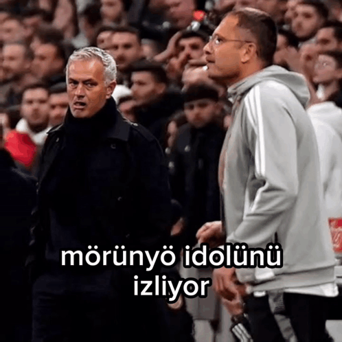 Two Men Standing In Front Of A Crowd With A Caption That Says Morunyo Idolunu Izliyor . GIF