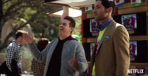 Two Men Standing In Front Of A Netflix Store GIF