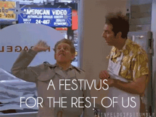 Two Men Standing In Front Of A Sign That Says ' American Video ' GIF