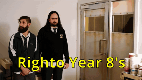 Two Men Standing in Front of Door With Right to Year 8's