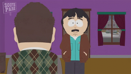 Two Men Standing in Front of South Park Sign