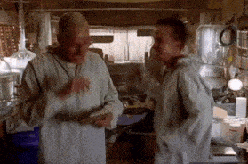 Two Men Standing In Kitchen Talking GIF