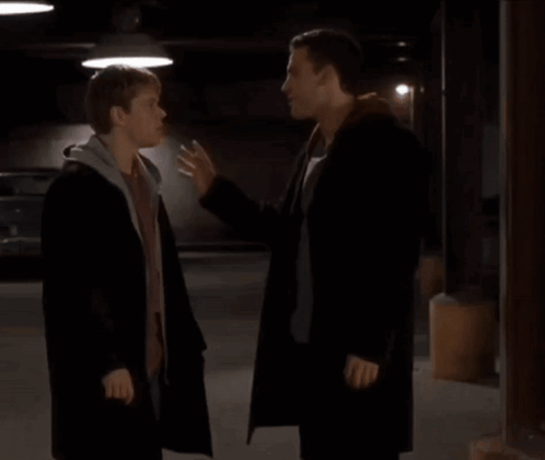 Two Men Standing In Parking Garage GIF