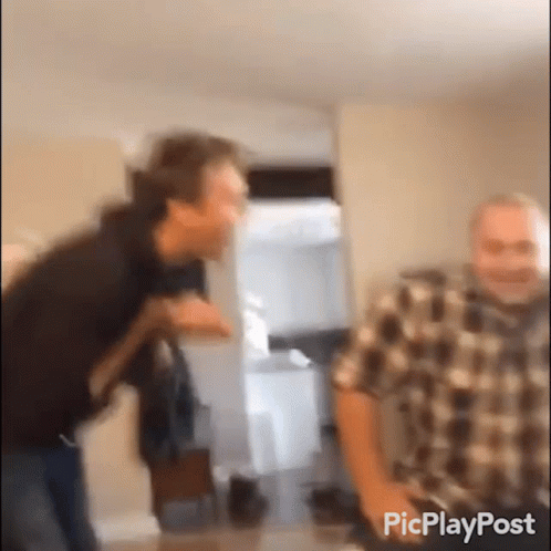 Two Men Standing In Room GIF
