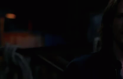 Two Men Standing In The Dark GIF