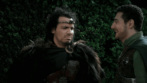 Two Men Standing In Woods GIF