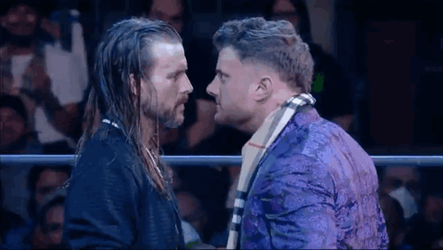 Two Men Standing in Wrestling Ring