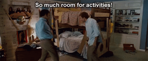 Two Men Standing Next To A Bunk Bed With The Words So Much Room For Activities Above Them GIF