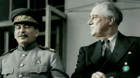 Two Men Standing Next to Each Other
