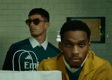 Two Men Standing Next to Each Other