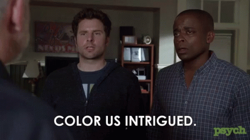 Two Men Standing Next to Each Other Color Us Intrigued