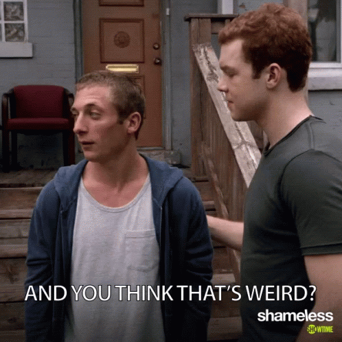 Two Men Standing Next To Each Other GIF