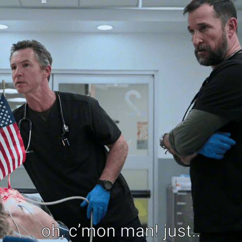 two men standing next to each other in a hospital room with the words ohc mon man just above them