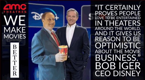 Two Men Standing Next To Each Other In Front Of An Amc Theatres Sign GIF