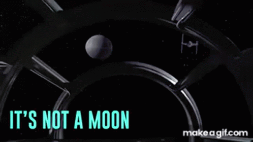 Two Men Standing Next to Each Other It's Not a Moon