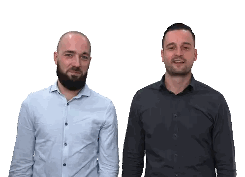 Two Men Standing Next to Each Other