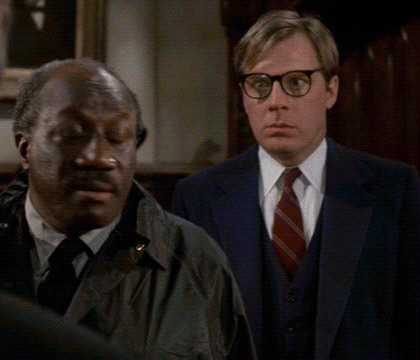 Two Men Standing Next To Each Other One With Glasses GIF