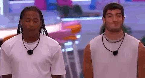 Two Men Standing Next to Each Other