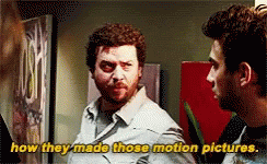 Two Men Standing Next to Each Other Saying How They Made Those Motion Pictures